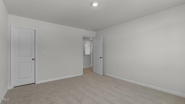3040 Platinum Cir W, End, NC 27376 - spare room featuring light colored carpet and baseboards
