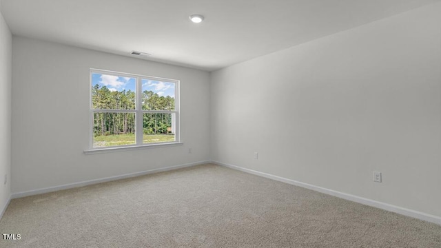 3040 Platinum Cir W, End, NC 27376 - spare room featuring light carpet and baseboards