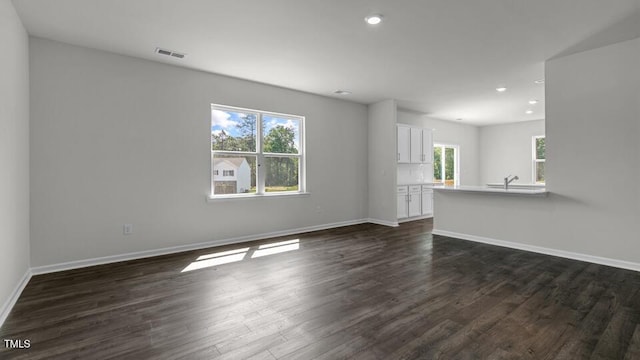 3040 Platinum Cir W, End, NC 27376 - unfurnished living room featuring dark wood-style flooring and recessed lighting