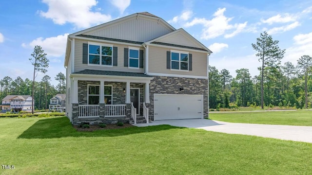 3040 Platinum Cir W, End, NC 27376 - craftsman inspired home with covered porch, concrete driveway, a garage, a front lawn, and stone siding