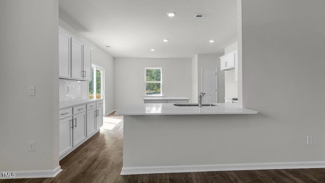3040 Platinum Cir W, End, NC 27376 - kitchen featuring light countertops, a peninsula, white cabinetry, dark wood-style floors, and recessed lighting