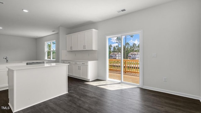 3040 Platinum Cir W, End, NC 27376 - kitchen featuring dark wood-style floors, light countertops, white cabinetry, and recessed lighting