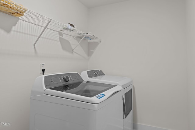 laundry area featuring laundry area and washing machine and dryer