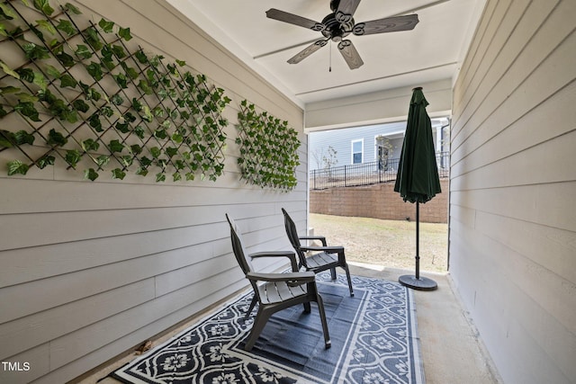view of patio / terrace featuring fence and ceiling fan