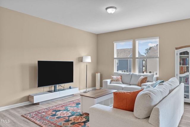 656 Dallas Rose Dr, Wendell, NC 27591 - living room featuring light wood-style floors and baseboards