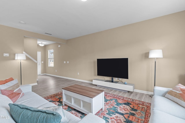 656 Dallas Rose Dr, Wendell, NC 27591 - living area featuring visible vents, baseboards, and wood finished floors