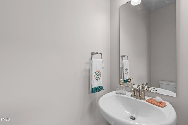 656 Dallas Rose Dr, Wendell, NC 27591 - half bathroom featuring a sink and toilet
