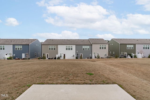 656 Dallas Rose Dr, Wendell, NC 27591 - back of house featuring a residential view and a lawn