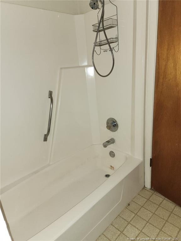 full bathroom featuring tile patterned floors and shower / tub combination