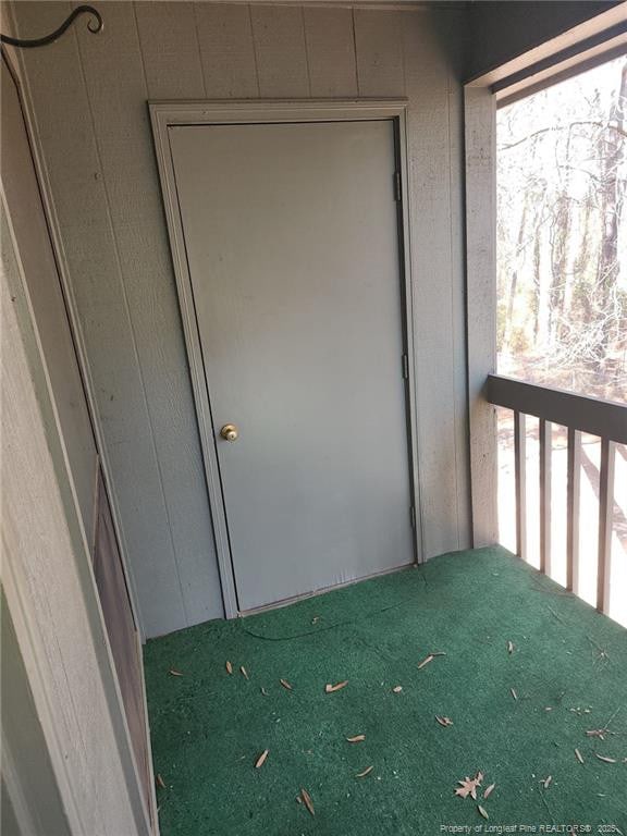 entrance to property with a balcony