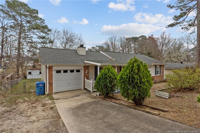 single story home with fence, concrete driveway, an attached garage, brick siding, and a chimney