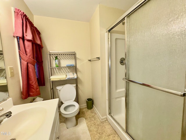 4715 Jacksontown Rd, Manson, NC 27553 - bathroom featuring toilet, a stall shower, vanity, and baseboards