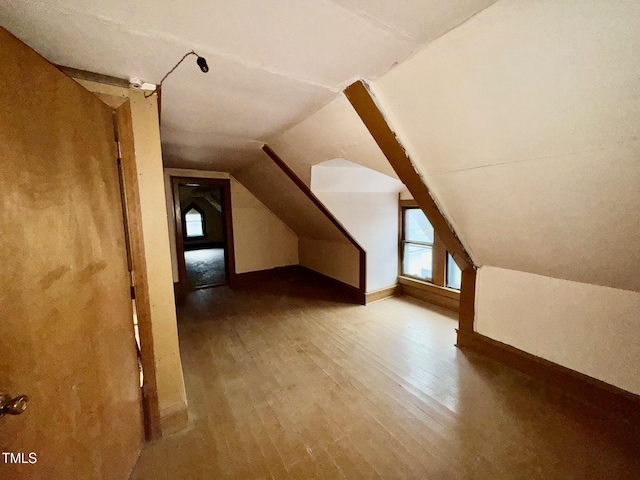 4715 Jacksontown Rd, Manson, NC 27553 - bonus room with baseboards, wood finished floors, and vaulted ceiling