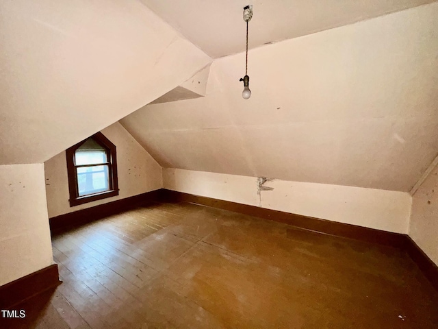 4715 Jacksontown Rd, Manson, NC 27553 - additional living space with wood-type flooring, baseboards, and lofted ceiling