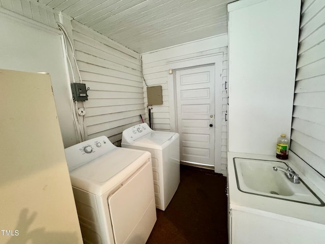 4715 Jacksontown Rd, Manson, NC 27553 - clothes washing area with a sink, independent washer and dryer, laundry area, and wooden walls