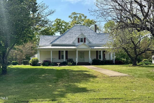 4715 Jacksontown Rd, Manson, NC 27553 - farmhouse inspired home with a porch, a chimney, and a front yard