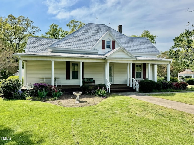 4715 Jacksontown Rd, Manson, NC 27553 - farmhouse with a porch and a front lawn