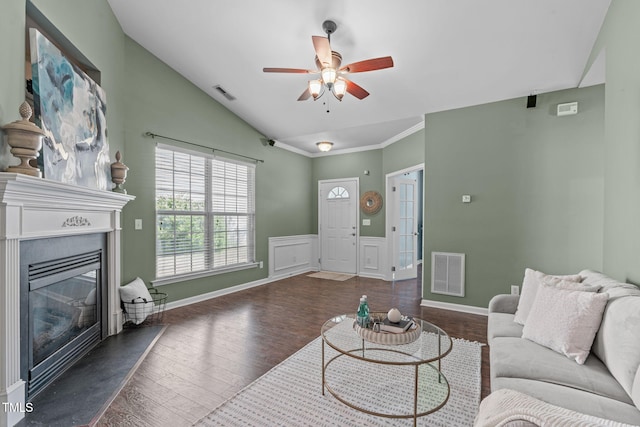 living area featuring visible vents, ceiling fan, lofted ceiling, and wood finished floors
