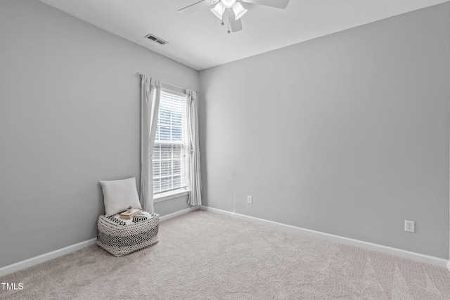 unfurnished room featuring baseboards, a ceiling fan, carpet, and visible vents