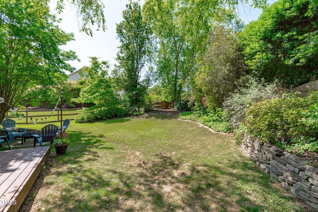 view of yard featuring a wooden deck