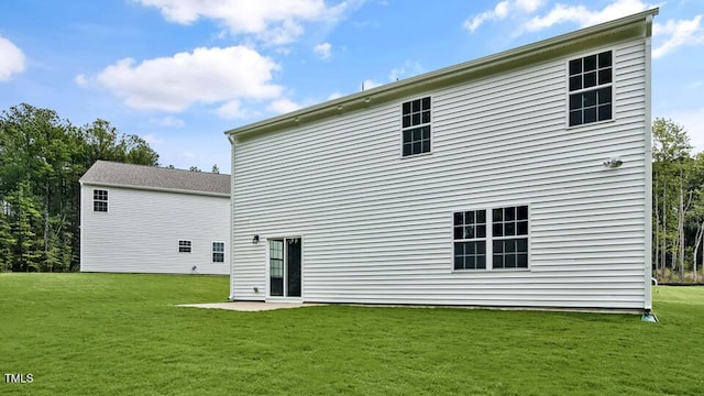 1005 Ocean Ct, Carthage, NC 28327 - back of house featuring a lawn