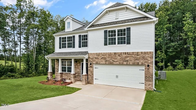 1005 Ocean Ct, Carthage, NC 28327 - view of front of property featuring brick siding, a garage, concrete driveway, a front yard, and a shingled roof
