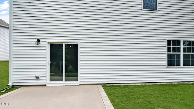 1005 Ocean Ct, Carthage, NC 28327 - view of exterior entry featuring a patio area