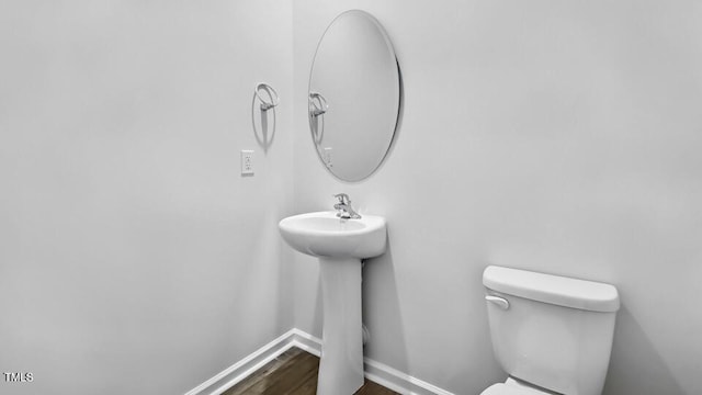 1005 Ocean Ct, Carthage, NC 28327 - half bathroom featuring toilet and wood finished floors