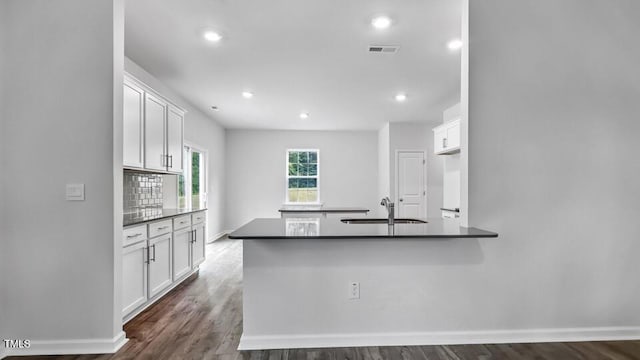 1005 Ocean Ct, Carthage, NC 28327 - kitchen featuring dark countertops, white cabinetry, dark wood-type flooring, and recessed lighting