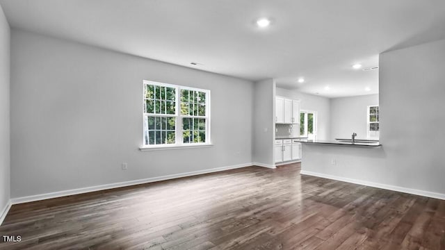 1005 Ocean Ct, Carthage, NC 28327 - unfurnished living room with dark wood finished floors and recessed lighting