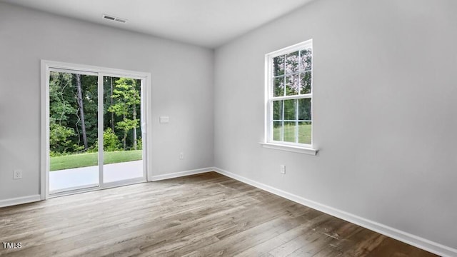 1005 Ocean Ct, Carthage, NC 28327 - spare room featuring healthy amount of natural light and wood finished floors