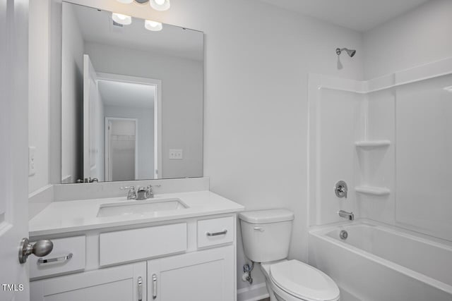 bathroom with toilet, vanity, and  shower combination