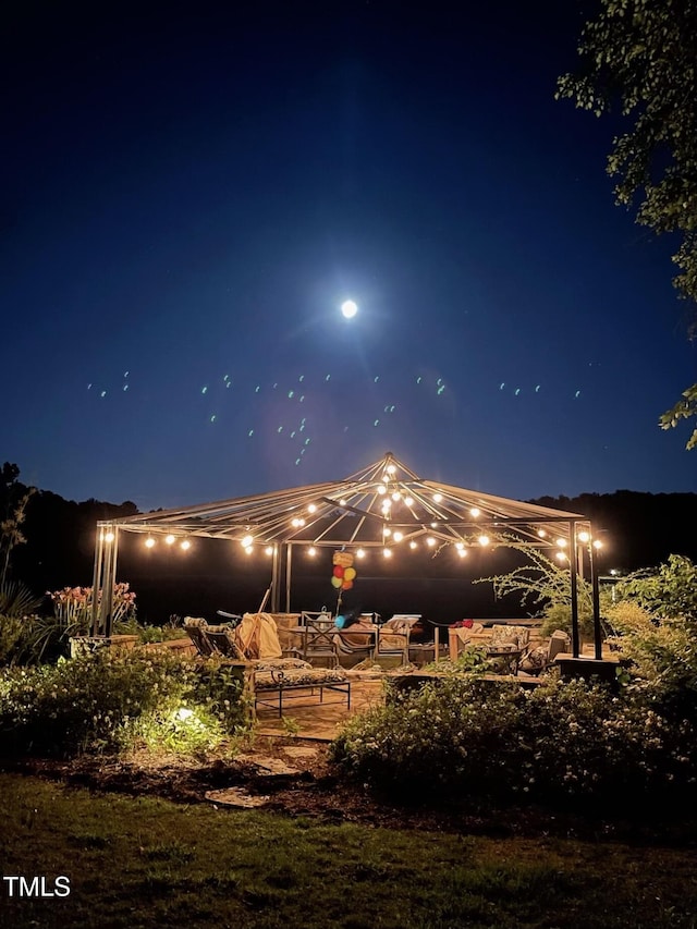view of yard at twilight