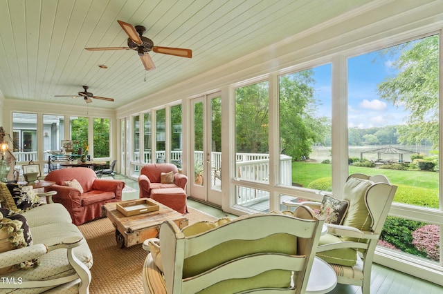 sunroom featuring wooden ceiling, healthy amount of natural light, and french doors