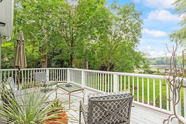 deck featuring a lawn