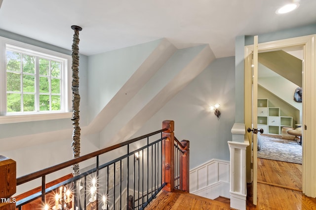 stairway with wood finished floors