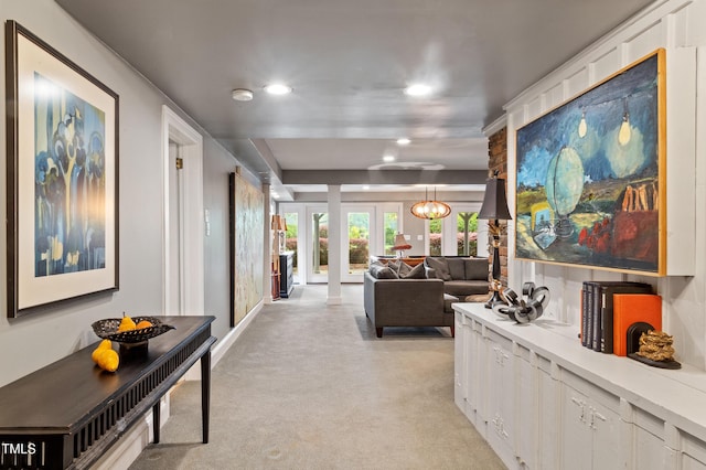 corridor featuring light colored carpet, recessed lighting, and baseboards