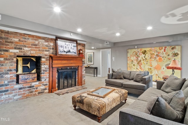 carpeted living area featuring recessed lighting and a fireplace