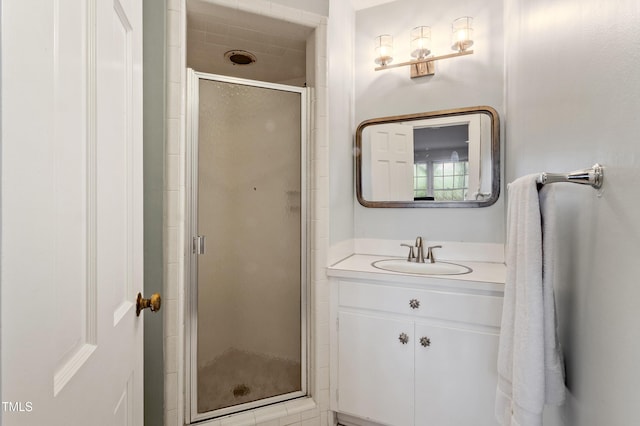 bathroom featuring a stall shower and vanity