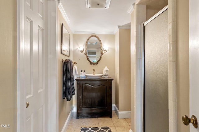 full bathroom featuring crown molding, baseboards, a stall shower, tile patterned flooring, and vanity