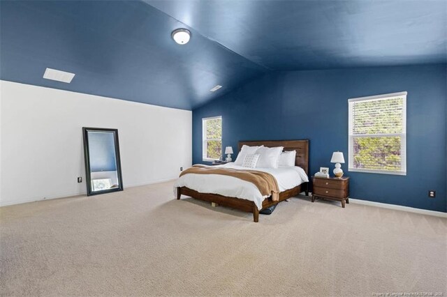 bedroom with baseboards, carpet flooring, multiple windows, and vaulted ceiling