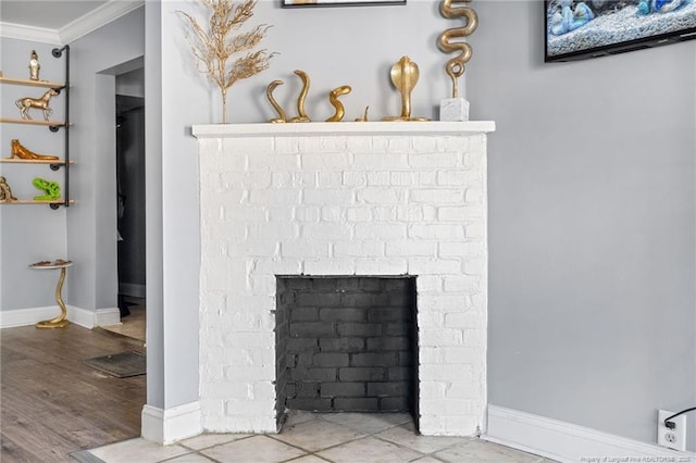 details with a fireplace, crown molding, wood finished floors, and baseboards