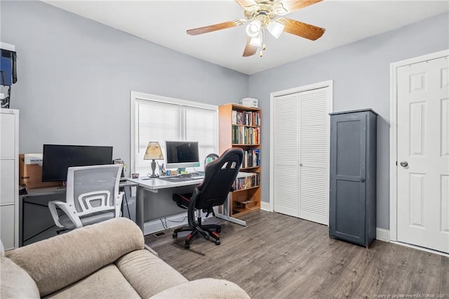 office area with ceiling fan, baseboards, and wood finished floors