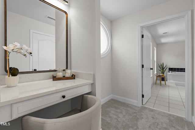 bathroom featuring baseboards, vanity, and visible vents