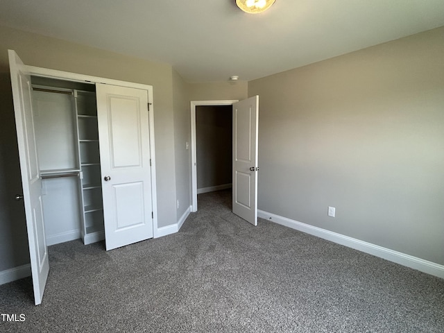 70 Prency Ln, Middlesex, NC 27557 - unfurnished bedroom featuring dark colored carpet and a closet