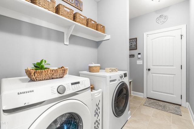 50 Lockamy Ln, Youngsville, NC 27596 - laundry room featuring light tile patterned floors, baseboards, separate washer and dryer, and laundry area
