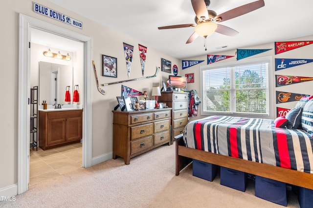 50 Lockamy Ln, Youngsville, NC 27596 - bedroom with baseboards, visible vents, ceiling fan, ensuite bathroom, and light colored carpet