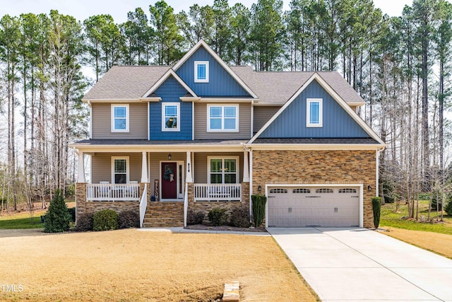 50 Lockamy Ln, Youngsville, NC 27596 - craftsman inspired home with stone siding, covered porch, an attached garage, and concrete driveway