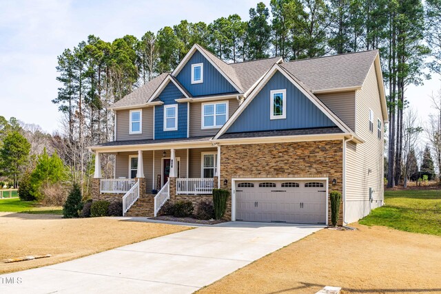 50 Lockamy Ln, Youngsville, NC 27596 - craftsman-style home with covered porch, an attached garage, and concrete driveway