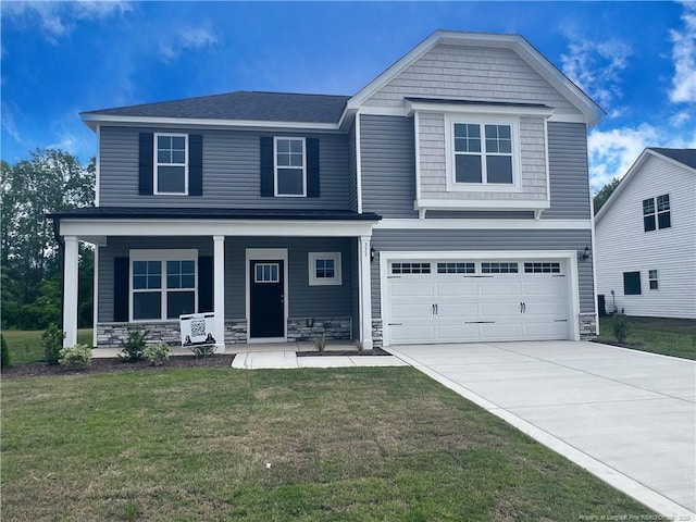 333 Edwinstowe Ave, Fayetteville, NC 28311 - view of front of home with stone siding, driveway, a garage, a front lawn, and a porch